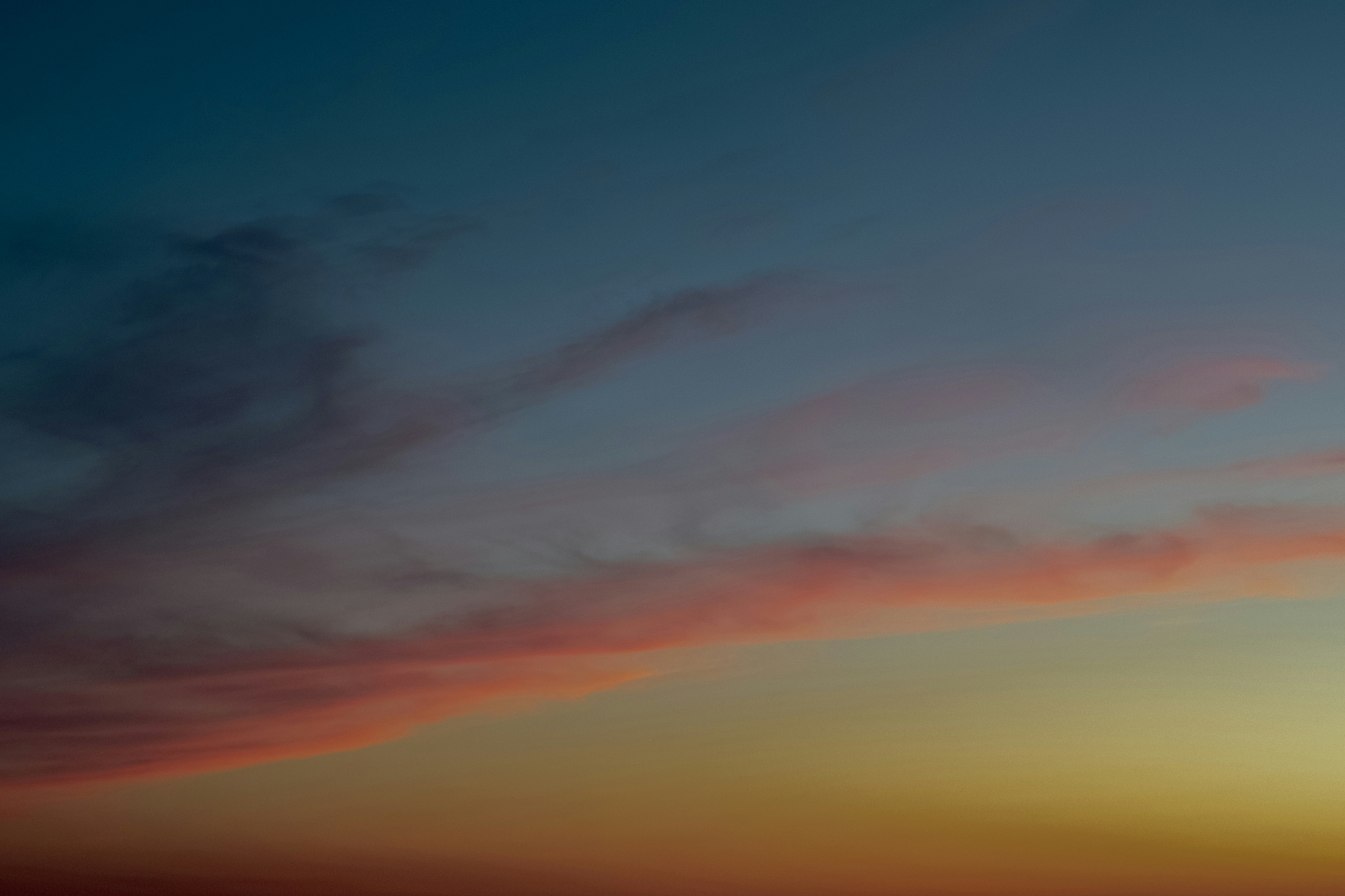 orange and blue cloudy sky during sunset